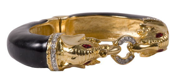 Kenneth Jay Lane gold and black enamel elephant head bracelet with diamond accents and red rhinestone eyes, $220 at Rapport