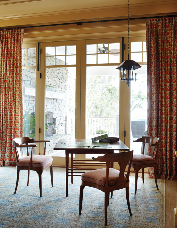 An Eve and Staron Studio rug ties the room together, incorporating the antique game table and chairs.