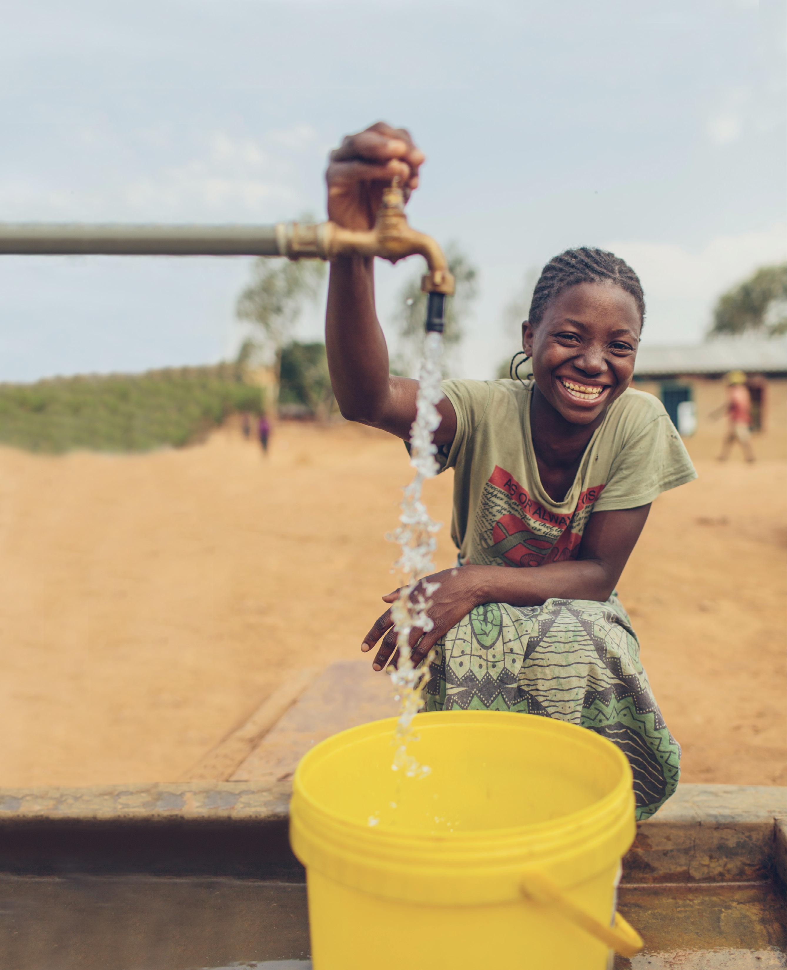 In 2009, Water Mission installed tap stands in this Malawi community after learning that children left home just before midnight each night to get in line at the nearest water source in order to have water the following day.