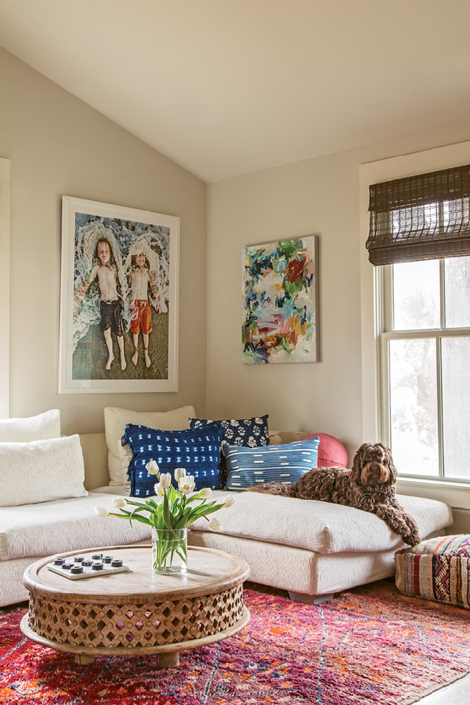 The twins (and Chief) can often be found hanging out on the white Nuevo Home sectional in this den off the kitchen. A round West Elm coffee table pinch-hits as a homework desk. Allison found the rug on a trip to Morocco, and the indigo pillows are from Dear Keaton.