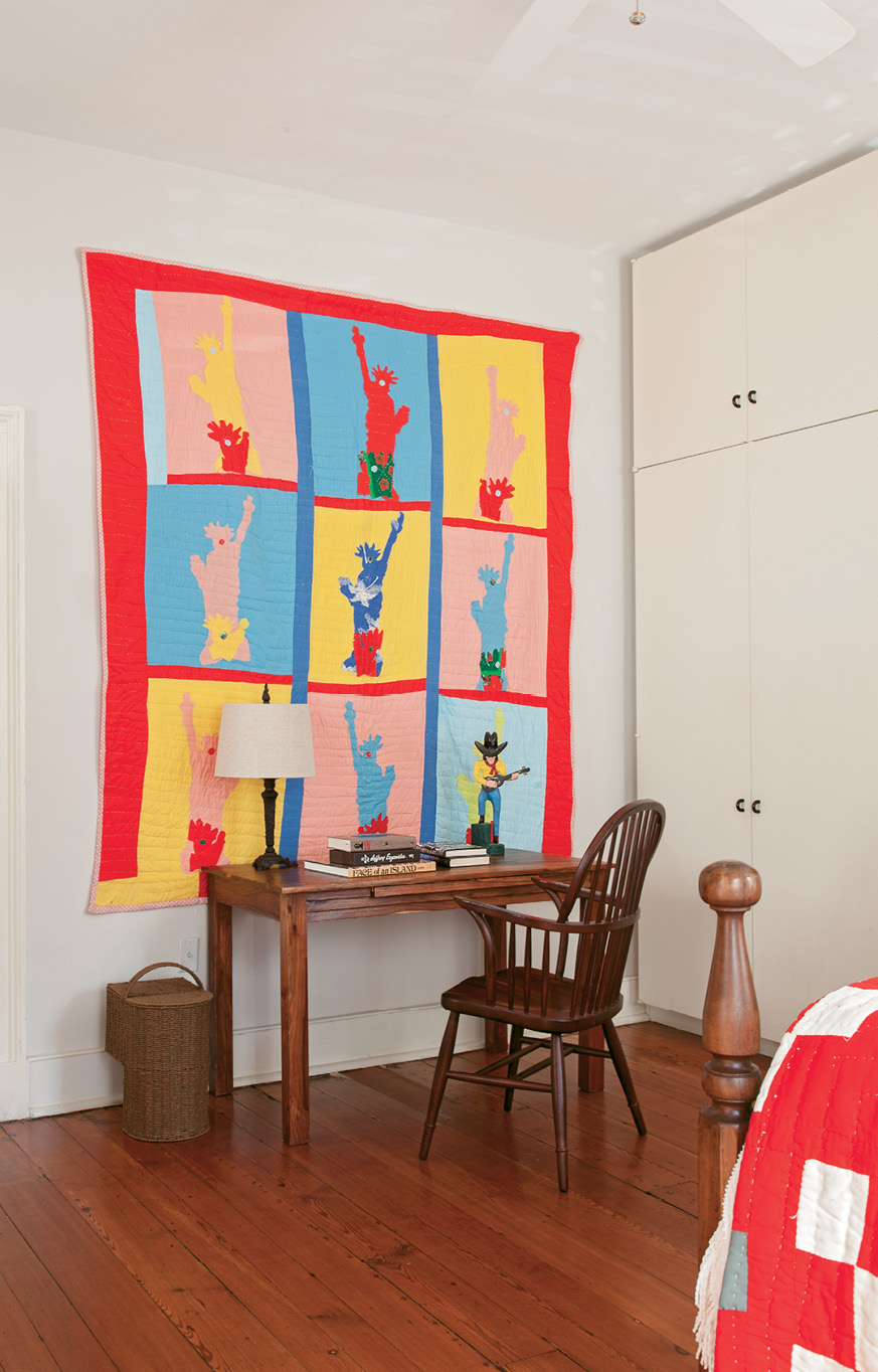 Mississippi artist Sarah Mary Taylor’s Statue of Liberty hand-sewn cotton quilt brightens up a simple wooden desk.