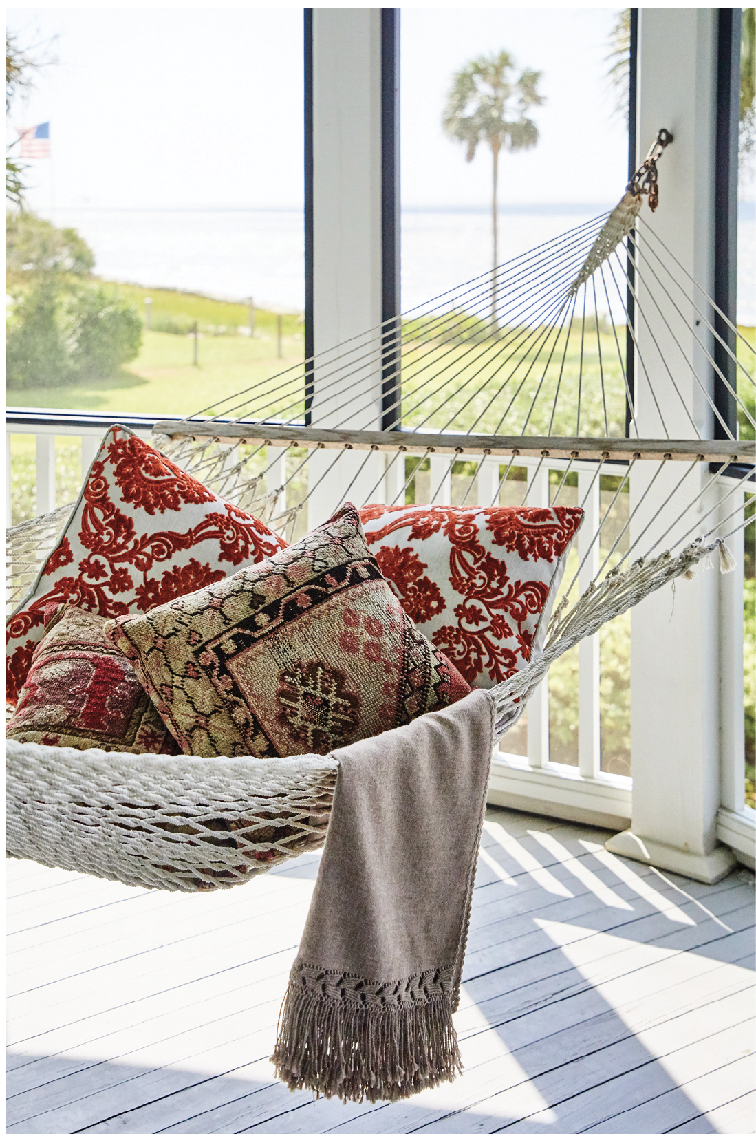 Plump pillows and a soft throw make this hammock an enviable post-meal napping spot.