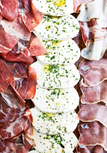 Slice of Heaven: Served with cured meats, mozzarella gets a lift with a sprinkling of chives, black pepper, sea salt, and extra-virgin olive oil.