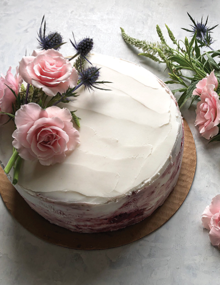 An almond-flour cake with strawberry jam filling and almond-coconut buttercream