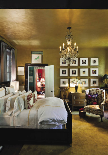 The master suite is ready for its close-up thanks to a top-to-bottom, golden-hued palette inspired by the 17th-century gilt bust of Kwan Yin, the Chinese goddess of mercy, and garnished with Andy Warhol’s portraits of celebrities, including Marlene Dietrich, Liza Minelli, and Joan Crawford. Hanging next to the doorway is a drawing by Swiss artist Alberto Giacometti.