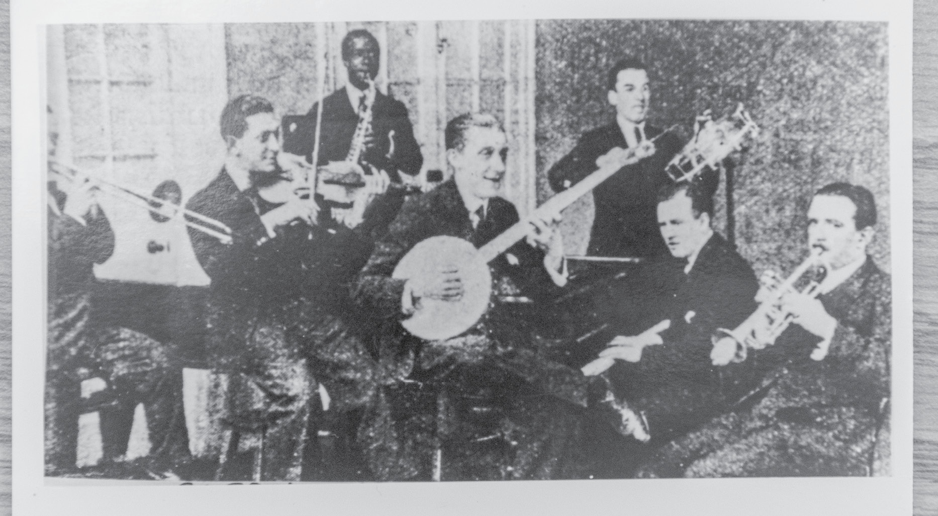 He led a popular dance band, The Queen’s Dance Orchestra (pictured here in May 1921), which cut several records.
