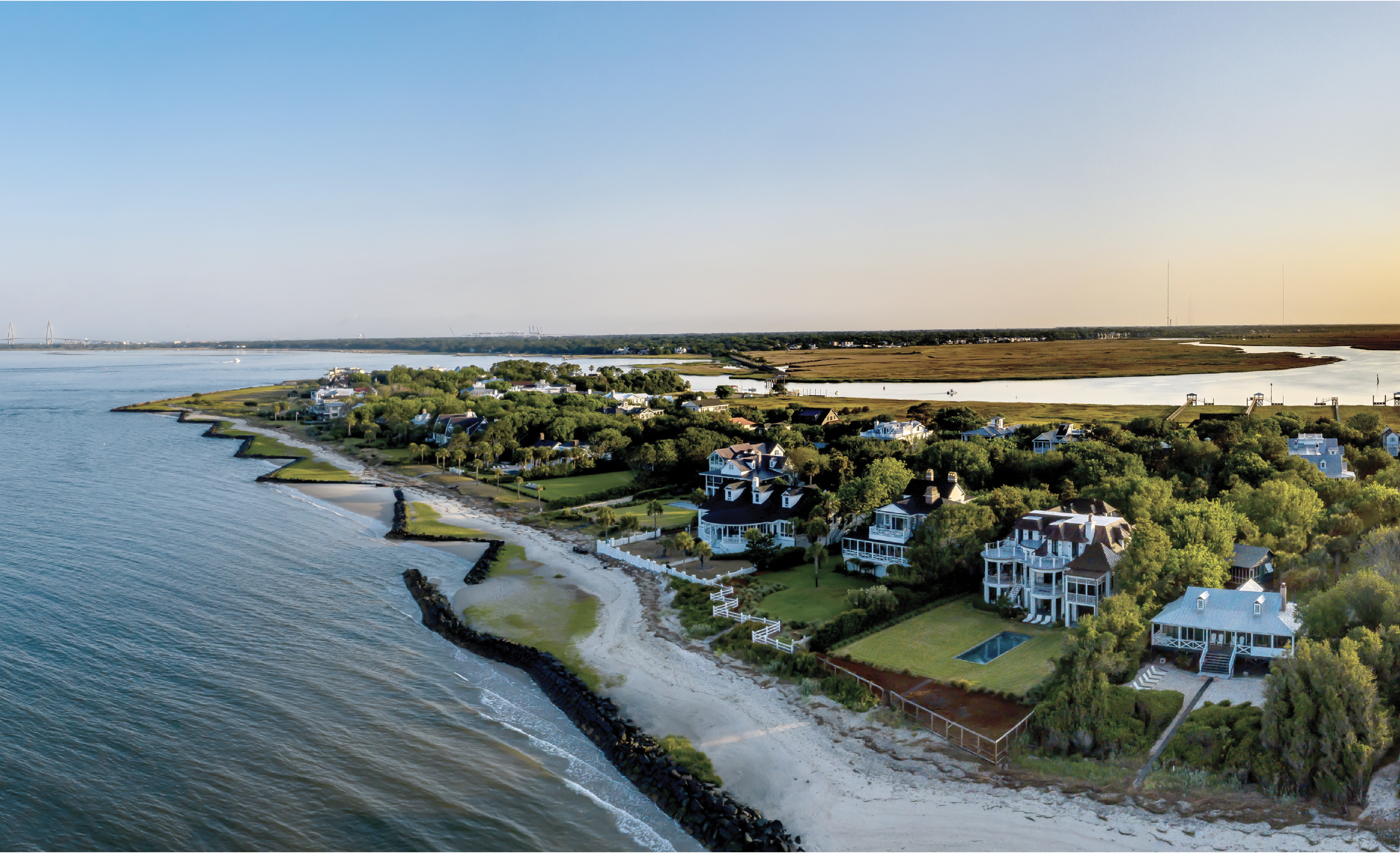 The southern tip of Sullivan’s near Fort Moultrie curves to the Intracoastal Waterway, with Mount Pleasant’s Old Village on the far side. There, a trolley bridge across Cove Inlet once connected summer residents to the island.