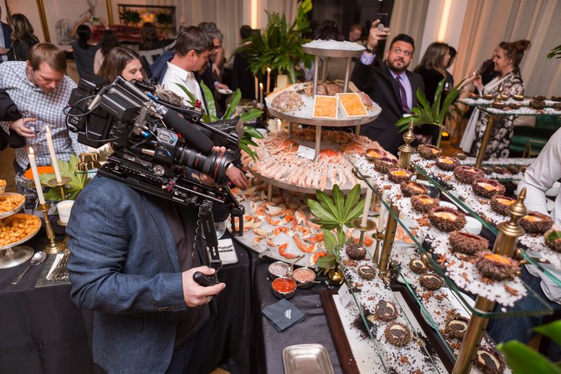 The Man Vs. Food film crew takes in the endless spread.