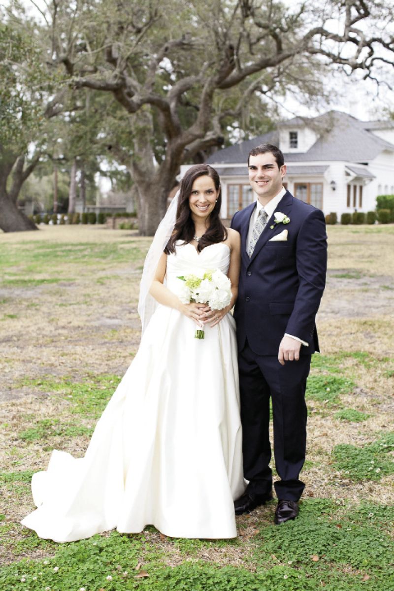 PICTURE PERFECT: While Brianna’s Modern Trousseau gown was a testament to elegant simplicity, Evan’s tie added pattern (and the wedding’s palette) to his Oleg Cassini suit.