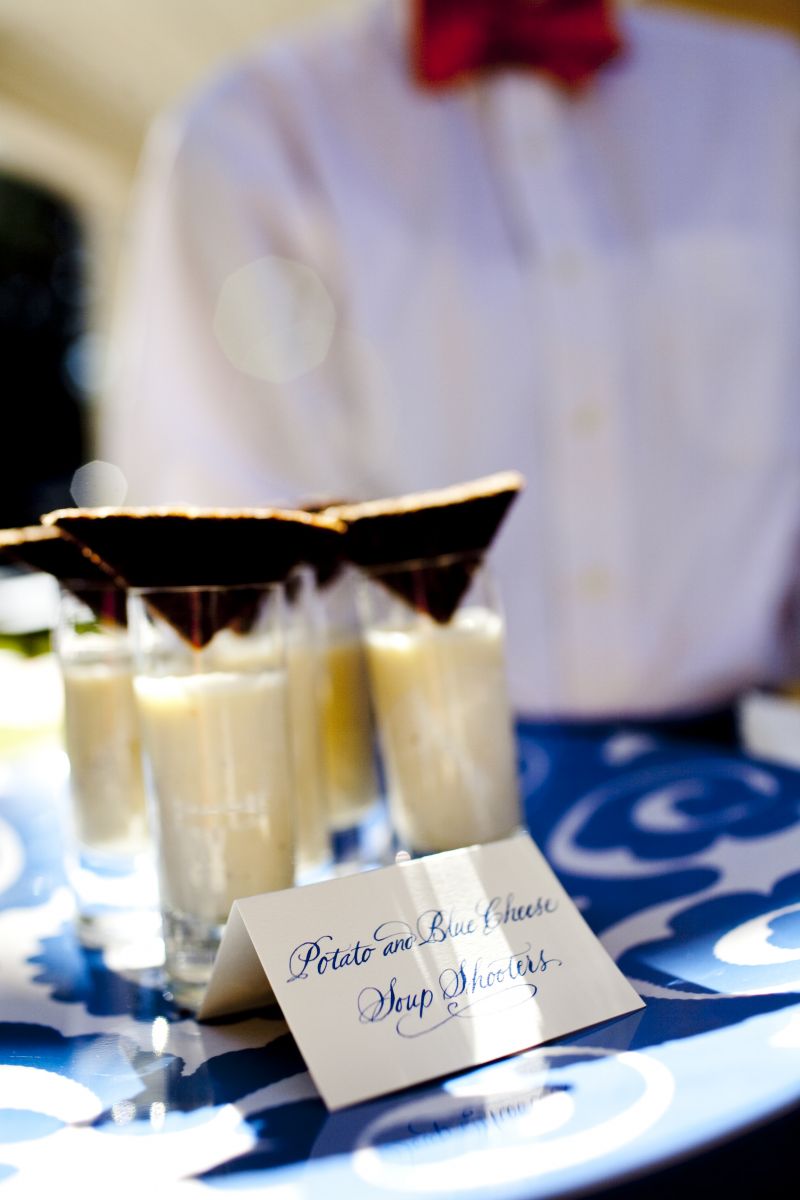 DIG IN: Potato and blue cheese soup shooters were one of five hors d’oeuvres served during the post-ceremony cocktail hour. Also served? Duck and apricot purses; fried lobster Rangoon; creamed goat cheese with sun dried tomatoes served on crispy cracker spoons; and tomato, mozzarella, and basil  skewers.