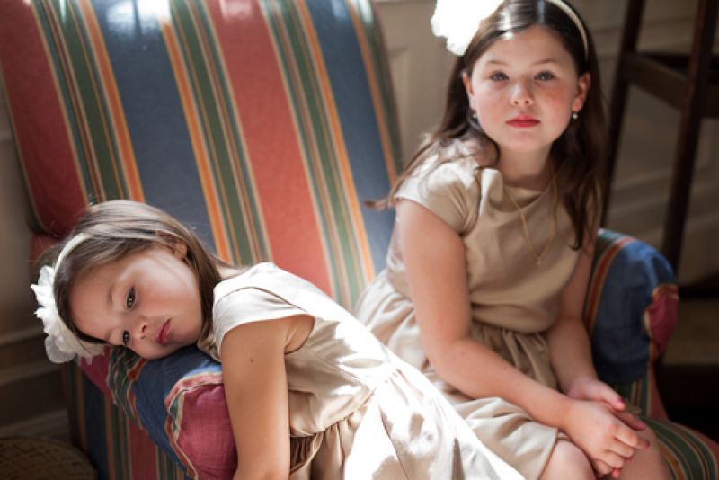 LADIES IN WAITNG: Annalise and older sister Ava got comfy, patiently sitting before the ceremony began.