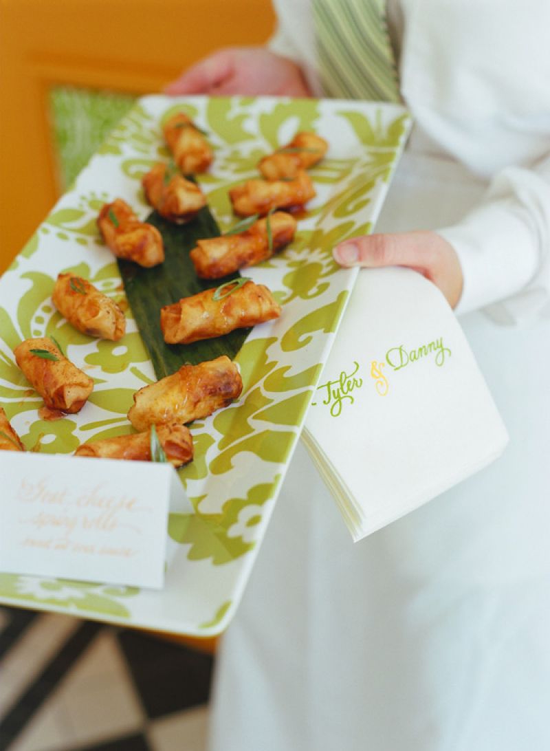PATTERN PERFECT: Serving trays bore the same lime green and white floral pattern as the aisle runner, ring bearer pillows, and other small details of the décor.