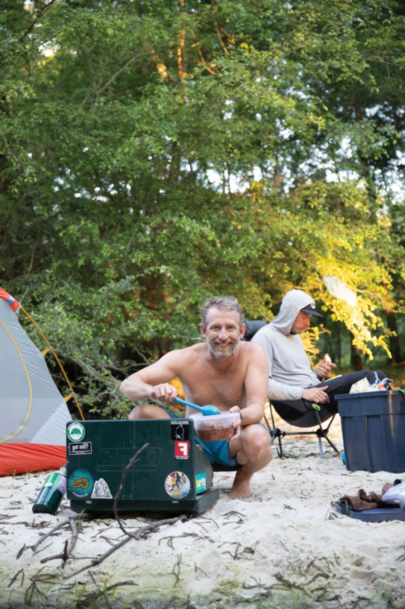 Co prepares dinner for the crew.