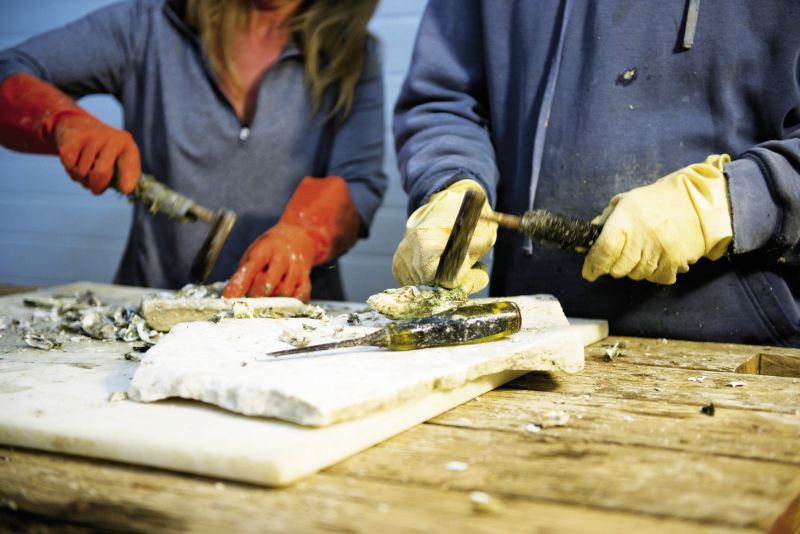 Many hours of labor go into sculpting his Caper’s Blades oysters from clusters into singles.