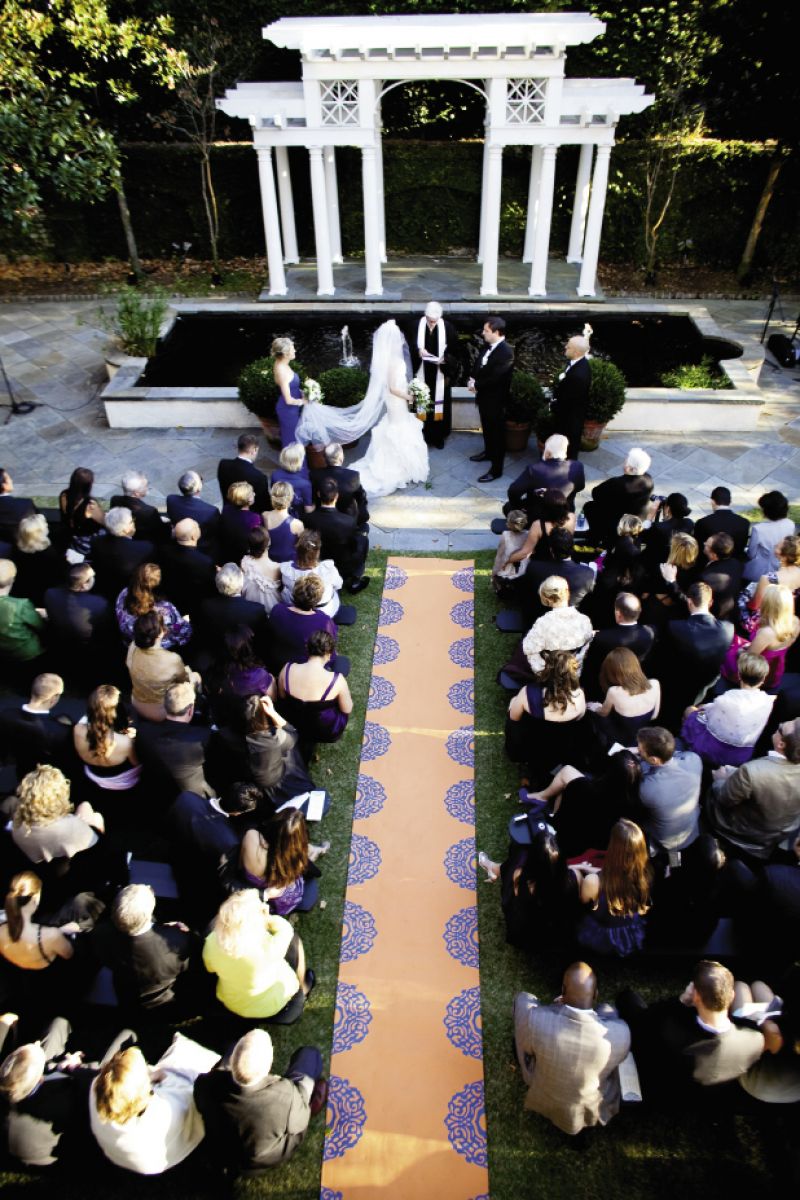 LEAD THE WAY: Anne Melvin of Boutique Tents custom-crafted the 21-foot aisle runner—a grand introduction to the evening’s bright-shaded theme.