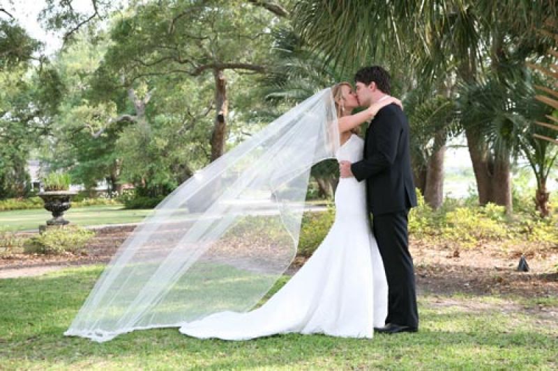 CANDID CAMERA: The bride wore an Anna Maier Ulla Maija gown and the groom sported a tux from Kleinfeld for Men.