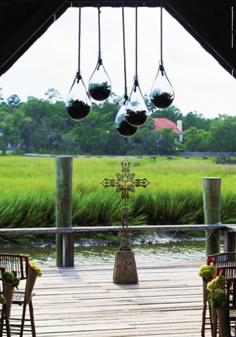 TEars of Joy: Teardrop-shaped vases dangled elegantly above the couple without drawing guests’ attention away from their vows.