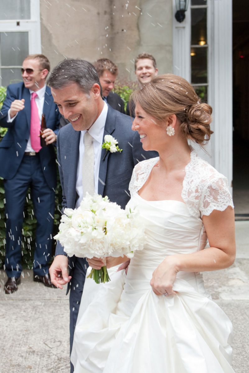 COME (RICE) RAIN OR SHINE: For their departure, the couple’s 74 guests showered them with dry white rice.
