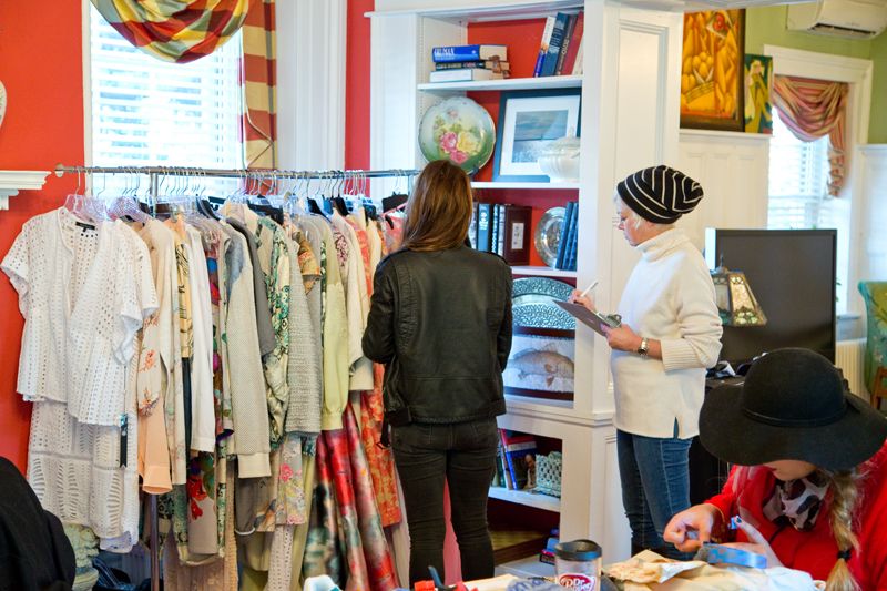 Stylist Holly Gray and photographer Caroline Knopf reviewing the wardrobe; photo by Mac Kilduff