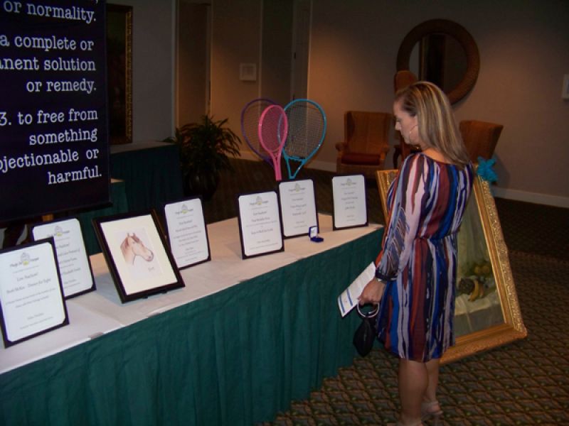 Derby Herlong browsing live auction goods