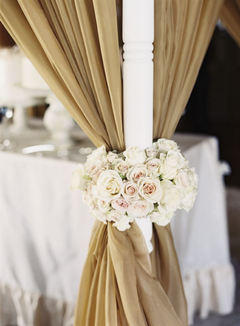 TICKLE ME PINK: Curtain tiebacks made from rose bouquets echoed the event&#039;s palette of neutral shades paired with white and blush pink.