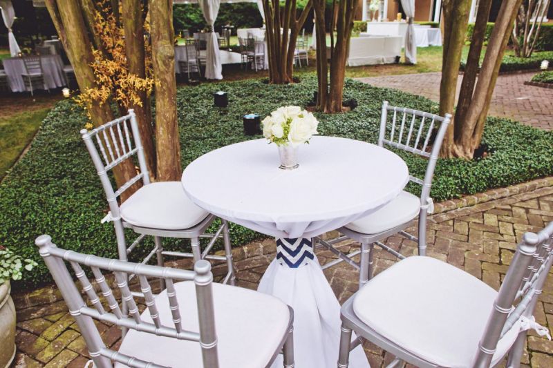 TABLE TALK: Chiavari bar stools and silver vessels dressed up cocktail tables.