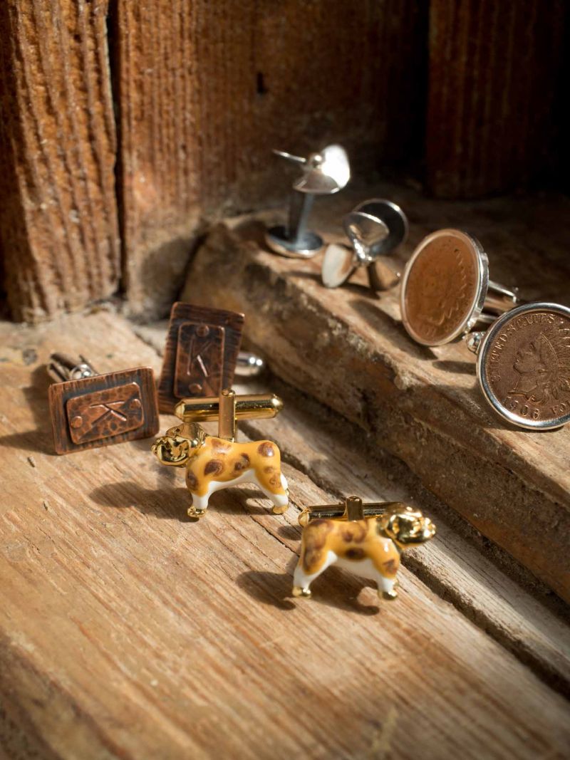 HIT THE LINKS: Raven’s sterling silver propeller cuff links from Grady Ervin &amp; Co. 18K gold and enamel bulldog cuff links from Croghan’s Jewel Box. Indian head penny cuff links from Kiawah Fine Jewelers. LavaLake brass and silver monogram cuff links from Charleston Tuxedo.