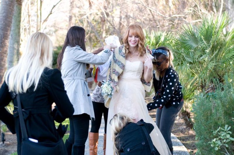 We’re nuts over this Anne Barge dress with its removable skirt. To get it shot, we dressed Chelsea, placed her in a prime photo spot while Juliet checked the light, Ashley touched up her legs, Ayoka fluffed her tulle layers, and the interns kept her toasty with the quilt until everything was set and all could step back. It takes a village! Photograph by Taylor Horton