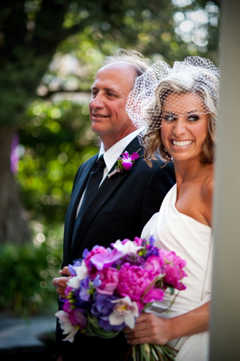 STYLE ME VINTAGE: Escorted down the aisle by her father, the bride wore a 1940s-inspired birdcage veil.