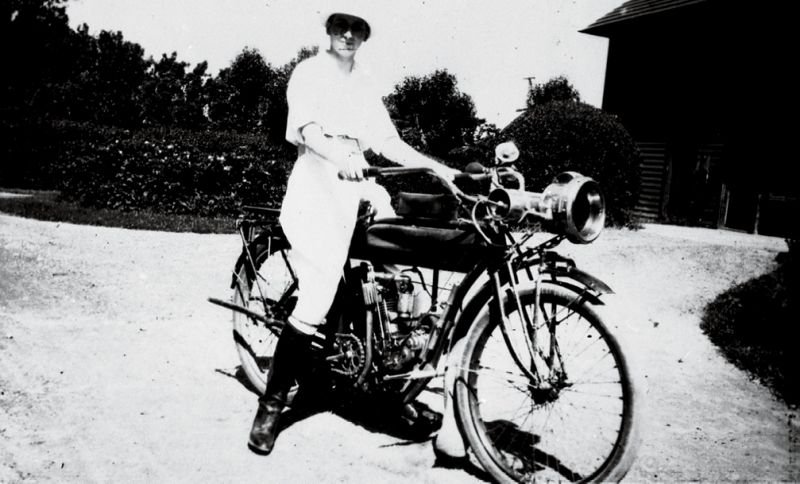 Belle rides a motorcycle at the family’s rented summer estate in 1915.
