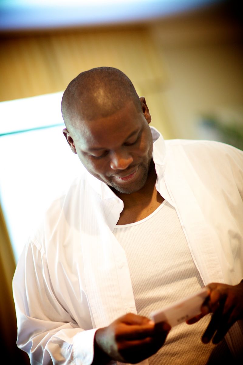 A SWEET SURPRISE: Cedric takes a break from getting ready to read the thoughtful note Richelle wrote him for the Big Day.