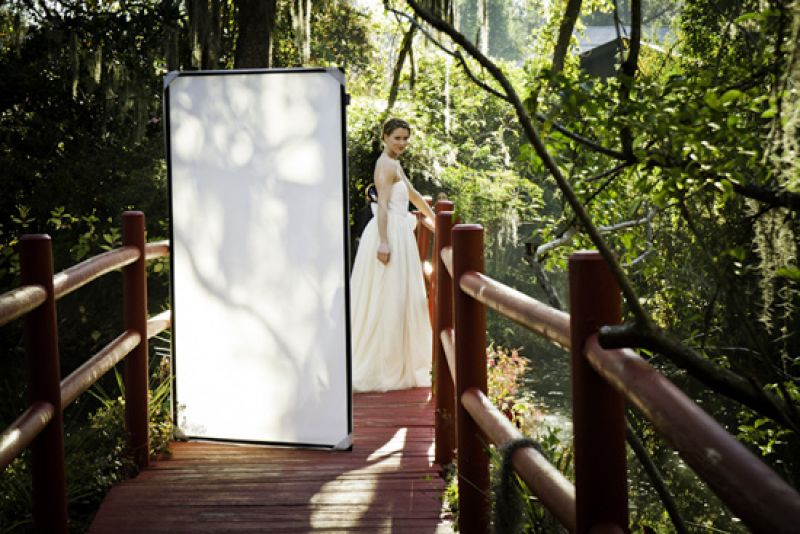 Magnolia is ripe with photogenic settings, like this Chinese red bridge by the atrium. The mix of the colors and the overgrown vegetation was dreamy! The screen was to bounce light onto her evenly from both sides. See the big clamps on her back? That’s because the sample size was too big and we had to improvise a good fit.