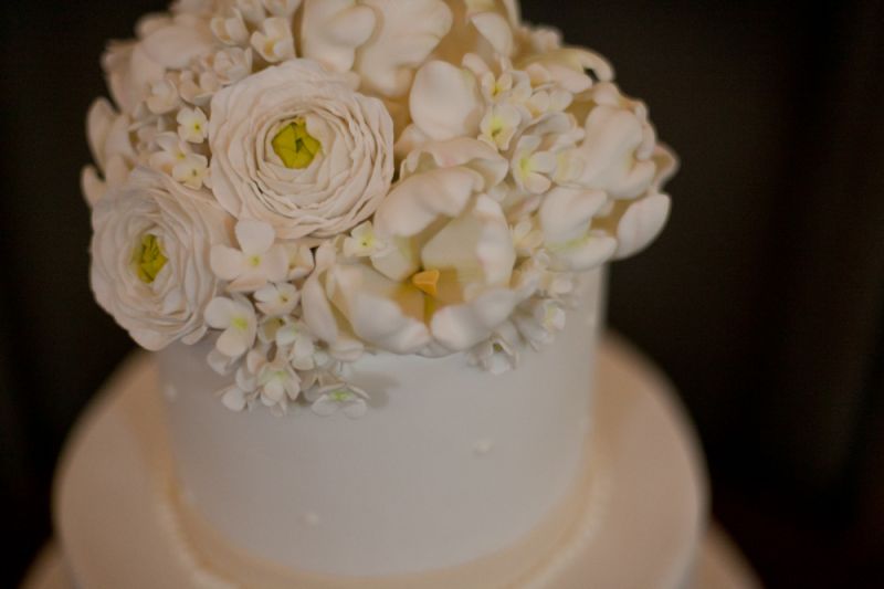 TOP THAT: The dessert was embellished with the couple’s custom monogram and Swiss dots.