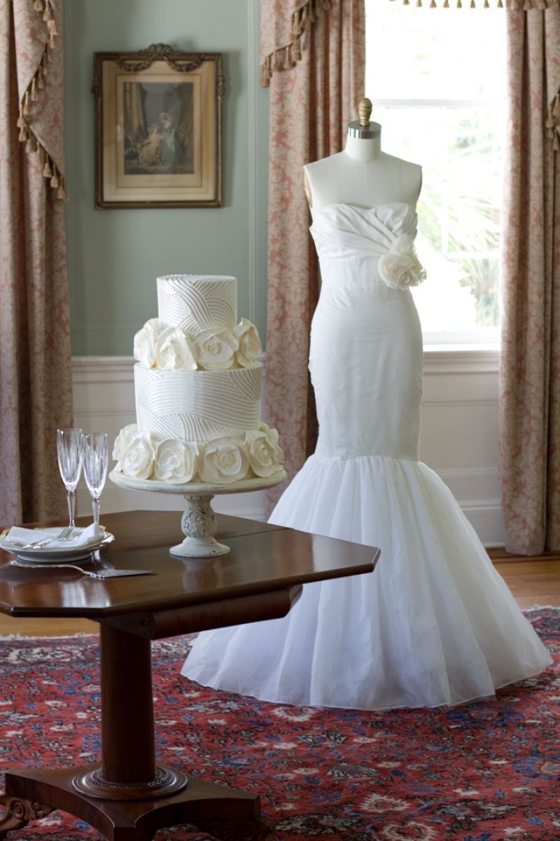 We tried several scenarios with the cakes and dresses, and eventually we decided to pull back the pretty rugs as they competed too much with the cakes, gowns, and draperies.