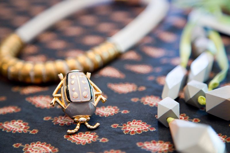 Beetle ring and necklaces from Cynthia Rowley; photo by Mac Kilduff
