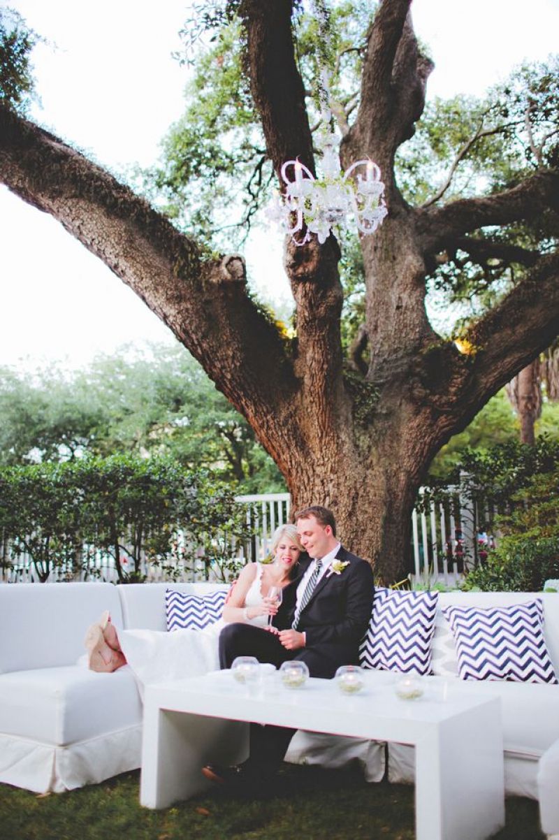 GET COZY: A good friend of the couple’s made the reception’s throw pillows, which now adorn their newlywed nest.