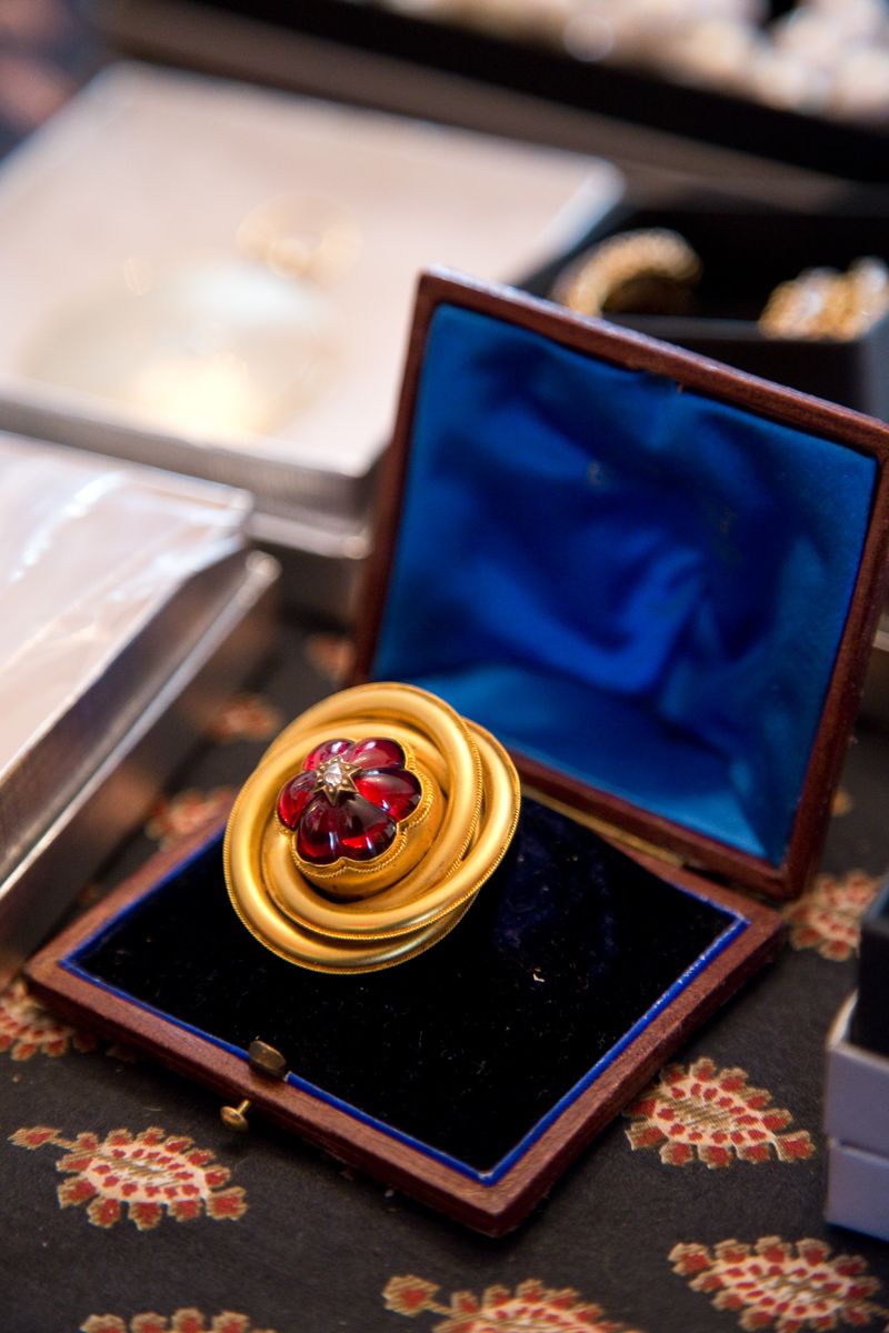 Garnet, diamond, and gold estate brooch from Croghan&#039;s Jewel Box; photo by Mac Kilduff
