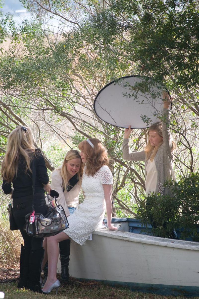 Hide Tide is a little skiff that has long been aground behind the Cottages and we loved how Chelsea looked perched on it. A good photographer is always on the lookout for similar photo ops. Thanks to Molly Hutter, Charleston Weddings editorial assistant, for acting as a sun shield to nab the shots! Photograph by Taylor Horton