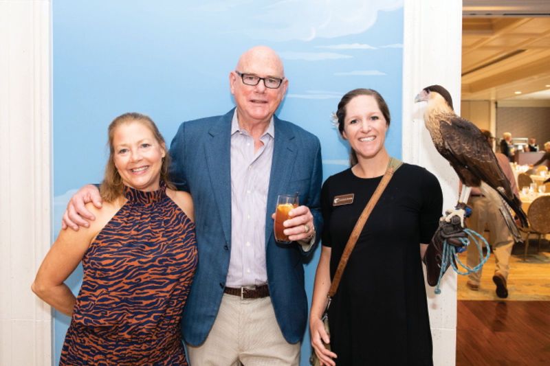 John and Kaye Nance with educator Natalie Hendrickson and a crested caracara