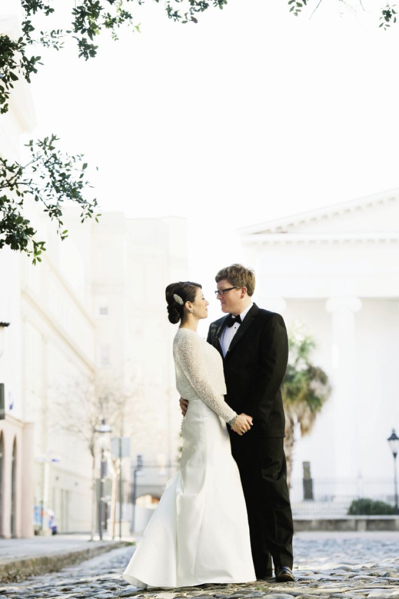 CLASSIC  STYLE: Chloe—a consultant for nonprofits—wore a vintage gown and jacket from The Bridal Garden, a not-for-profit resale bridal boutique in New York, while Paul, cofounder of a Houston-based men’s apparel company, went for a dapper JoS. A. Bank tuxedo.
