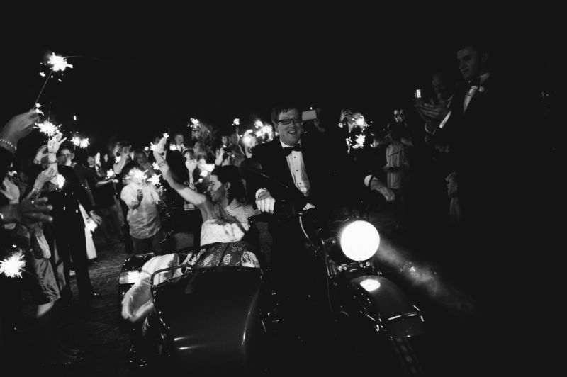 EXIT STRATEGY: “Typical of Paul’s sense of adventure and his ability to add an element of surprise to any setting, he shocked all the guests with our getaway—a motorcycle with a sidecar!” says Chloe of her husband’s exit plan vision. “We rode down a bustling King Street, waving at New Year’s Eve revelers.”