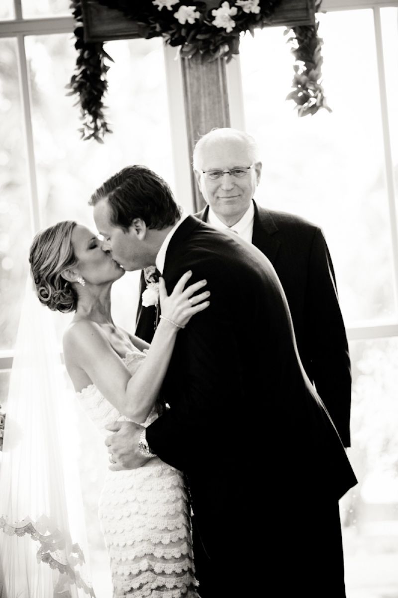 YOU MAY KISS THE BRIDE: Reverend Lou Lunardini of Bluffton officiated the nuptials.