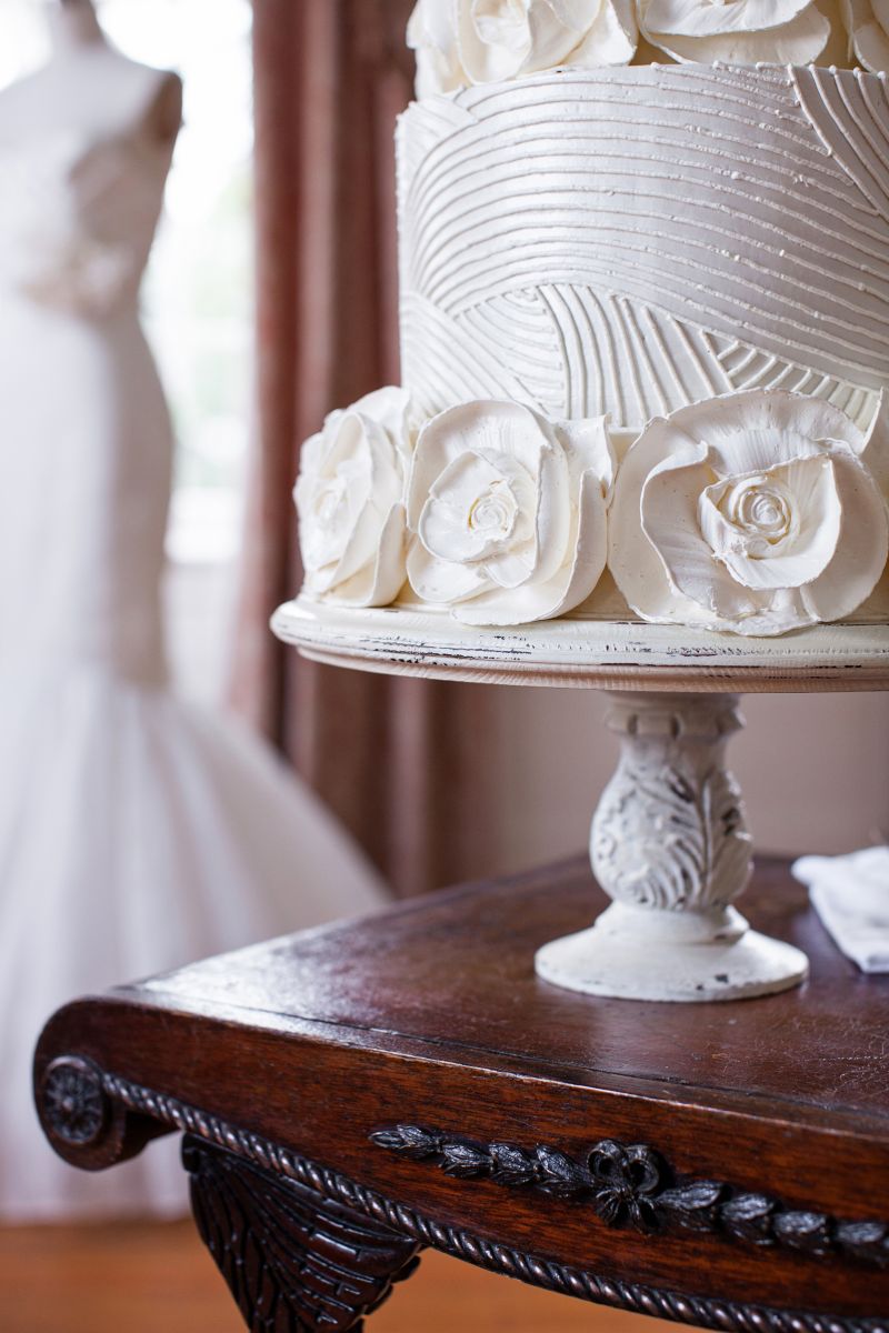 Jim’s collection of cake stands is rivaled only by the antiques in the plantation home, including this scrolled side table.