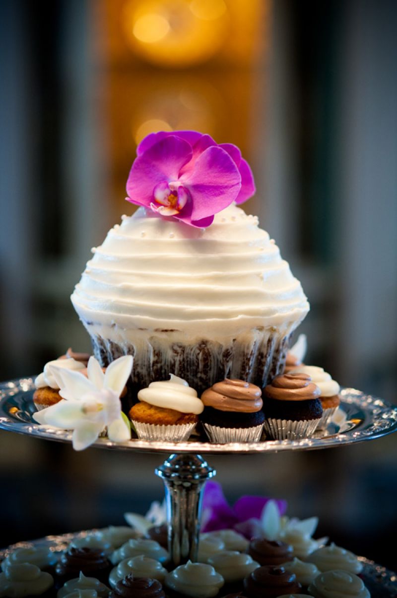 PRETTY PRESENTATION: WildFlour Pastry provided cupcakes both big and small. Accent flowers added color to the vanilla and chocolate sweets.