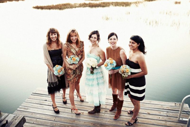 GAL PALS: Bridesmaids wore brown-hued frocks of their choosing. One of Lisa’s attendants, Rory Johnson (here, second from the right), gifted the bride the 1950s prom dress she wore as her wedding gown.