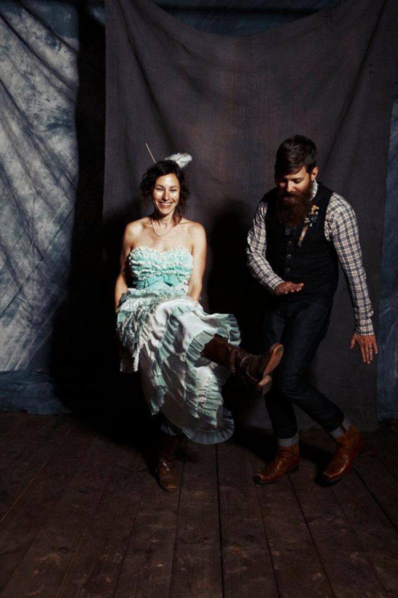SAY CHEESE! An old school backdrop brought the nuptials’ vintage-inspired theme to the photo booth.