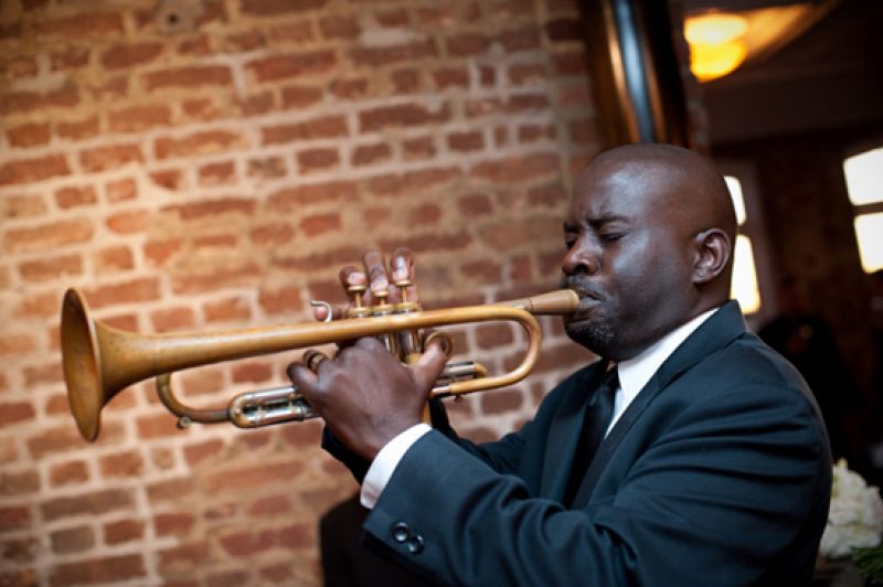 STRIKING A CHORD: Charlton Singleton of the Charleston Symphony Orchestra performed solo during the post-ceremony cocktail hour. For the reception, the conductor was joined by his band.