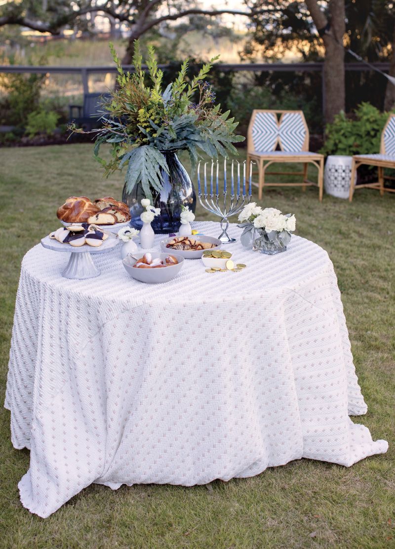 It’s safest for one person to serve everyone from the dessert table. This party’s guests chose from sufganiyot (traditional fried jelly doughnuts), rugelach, black-and-white cookies, and chocolate chip challah