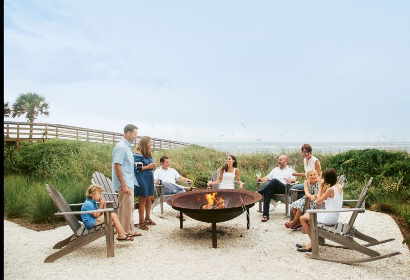 The family uses the fire pit, a 60-inch replica of a syrup kettle with a retrofitted grill, most Saturday nights to cook steaks and oysters.