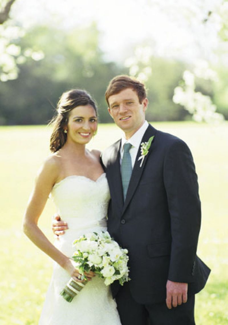 Well Matches: The couple went for a classic look—Candice in a strapless Rivini gown, and Graham wearing a charcoal-colored suit from Grady-Ervin &amp; Co. with an Hermès tie.